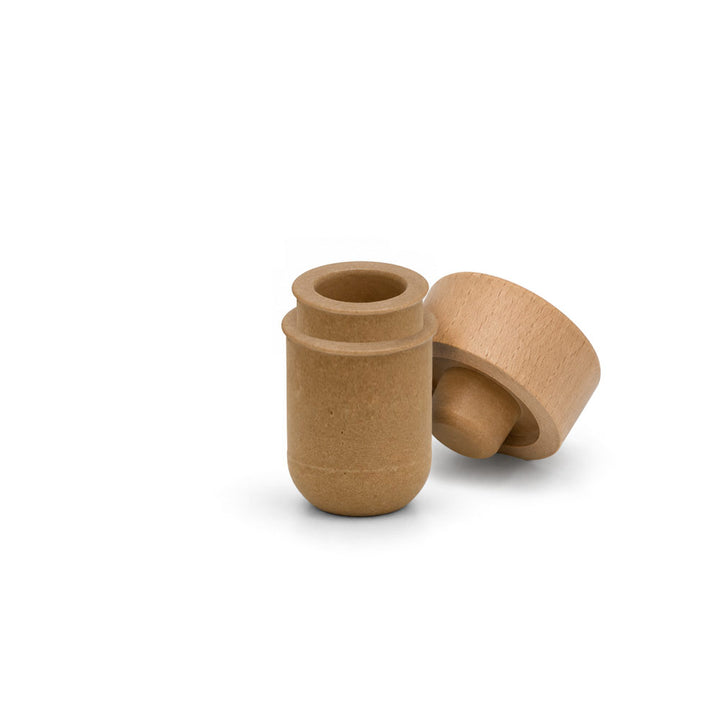 Two small cylindrical wooden caps or stoppers in a natural light brown wood finish, shown on a clean white background.